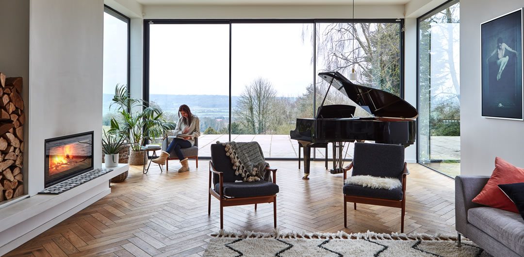 country-style kitchen with roaring fire and piano