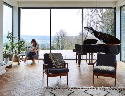 country-style kitchen with roaring fire and piano