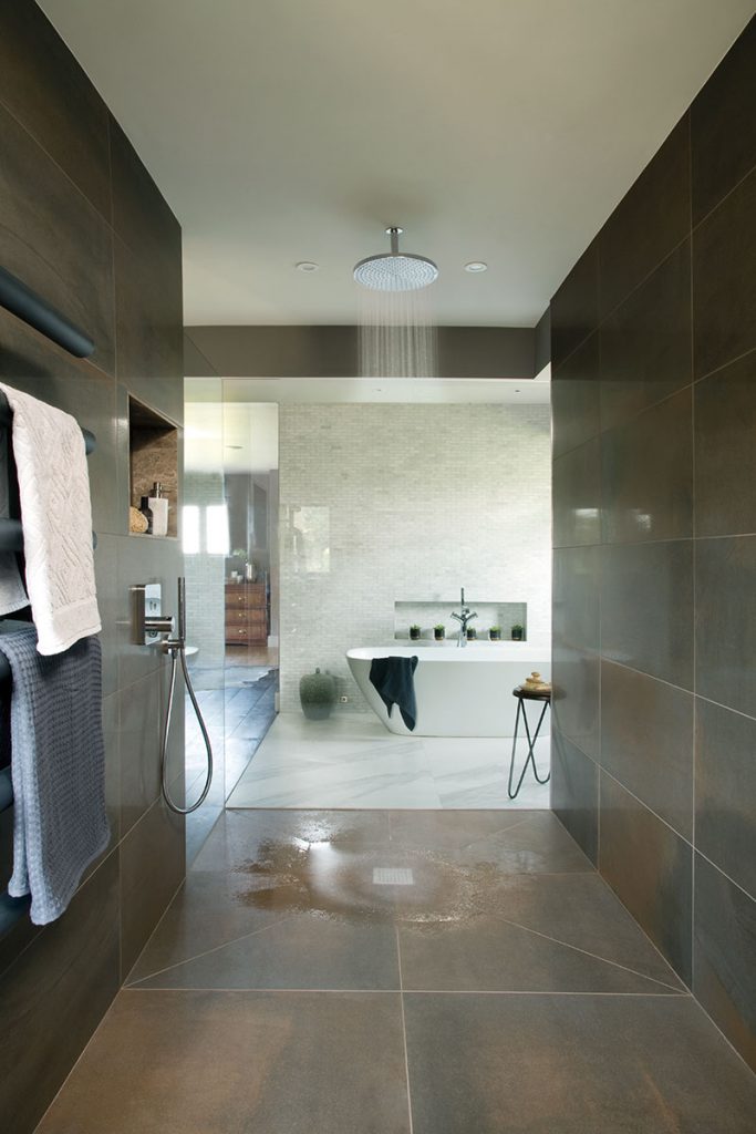 A large fan takes all the steam from the shower outside