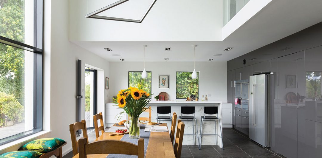 double-height kitchen with mezzanine in this house renovation