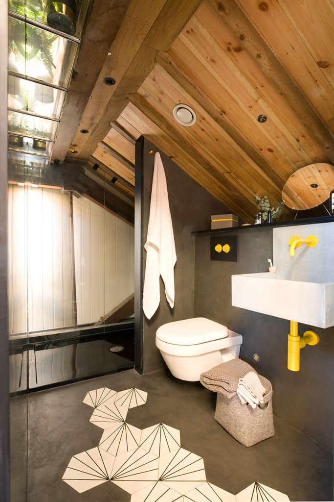 black and yellow bathroom with roof glazing