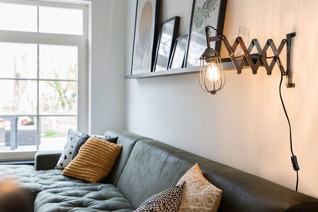 Industrial wall design with scissor arm 