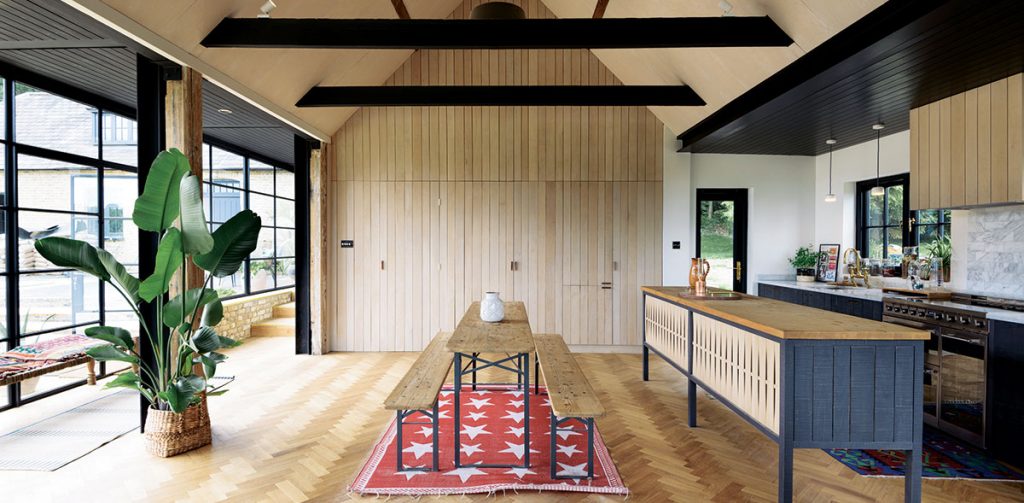 Kitchen in dark blue with natural wood features