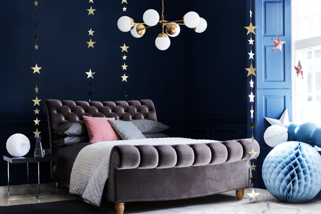 Navy bedroom design with star decoration and Christmas decorating ideas
