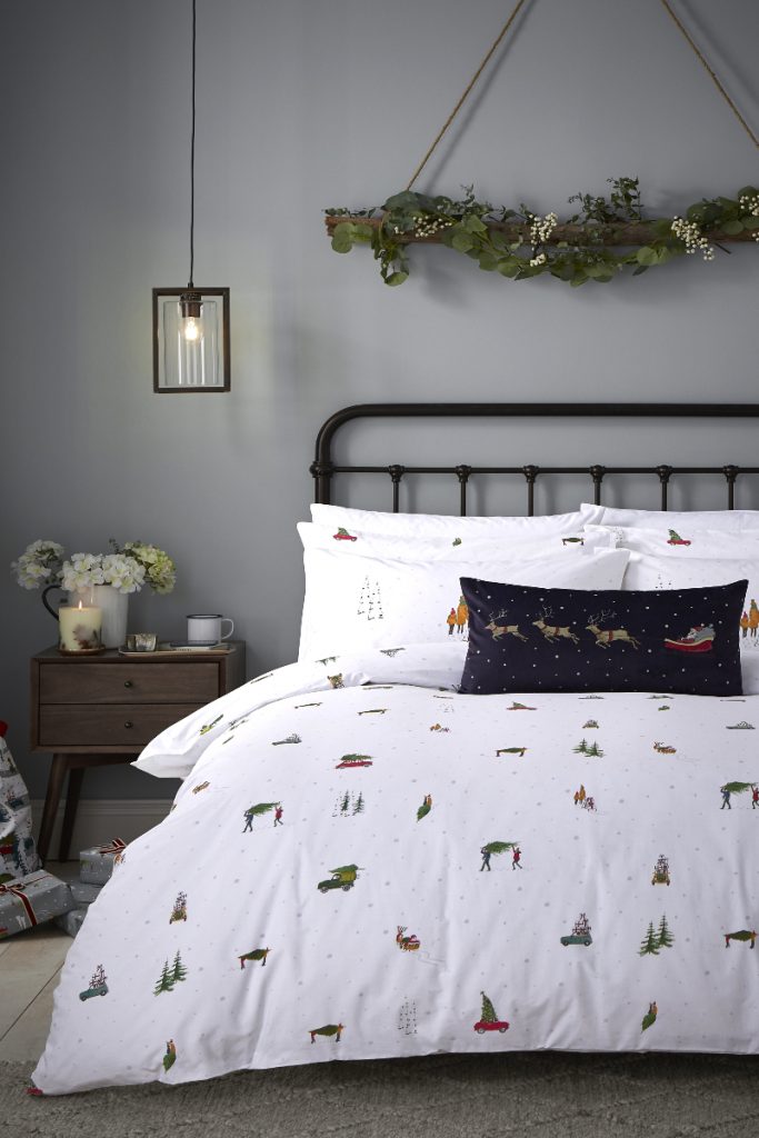 Bed with cars and trees linen