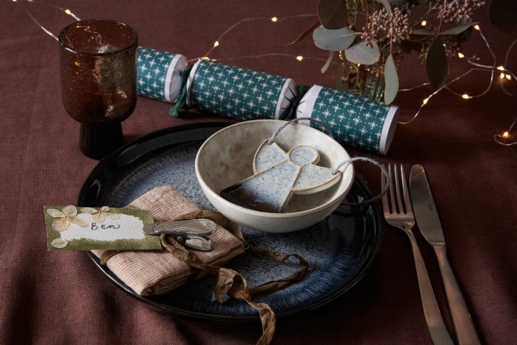 Denby Halo Angel placed as a trinket on plates for guests