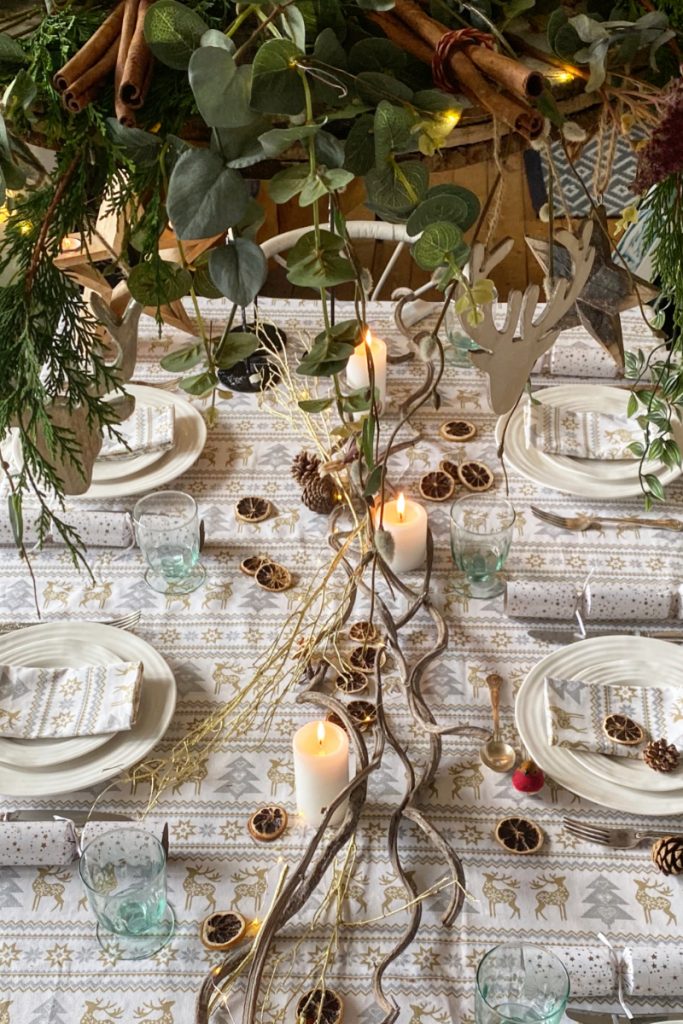 Reindeer napkins for Christmas tablescape  and dried orange foliage