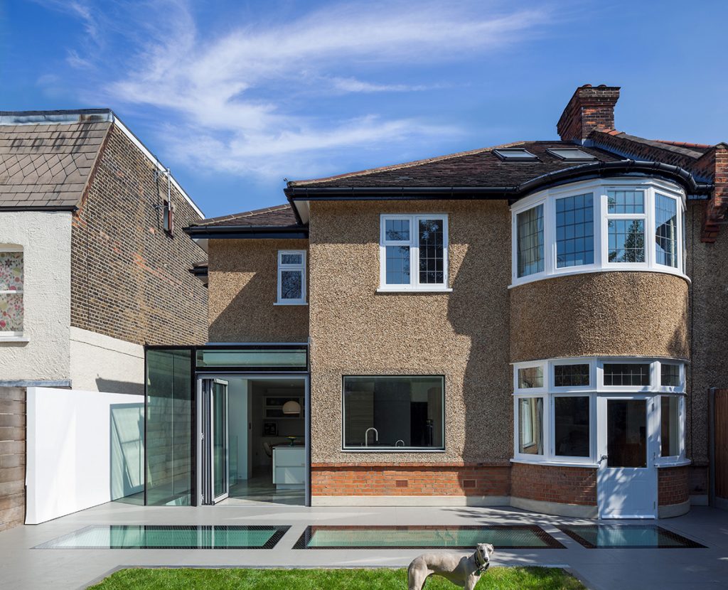 the outside of a semi-detached house with a kitchen extension