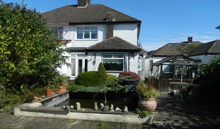 a garden overlooking a house