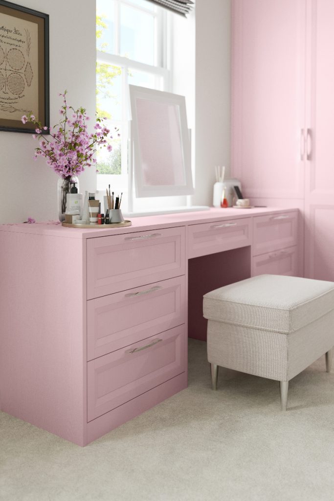a pink Crown Rimano Rose Shaker table with a beige stool and white mirror