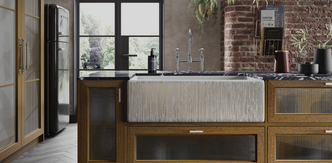 a ribbed white Belfast sink on a wooden counter top