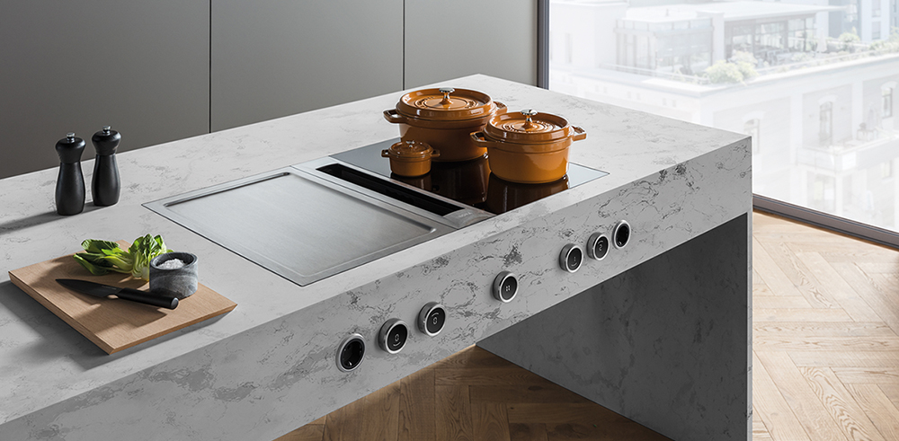an induction hob with two pans on it