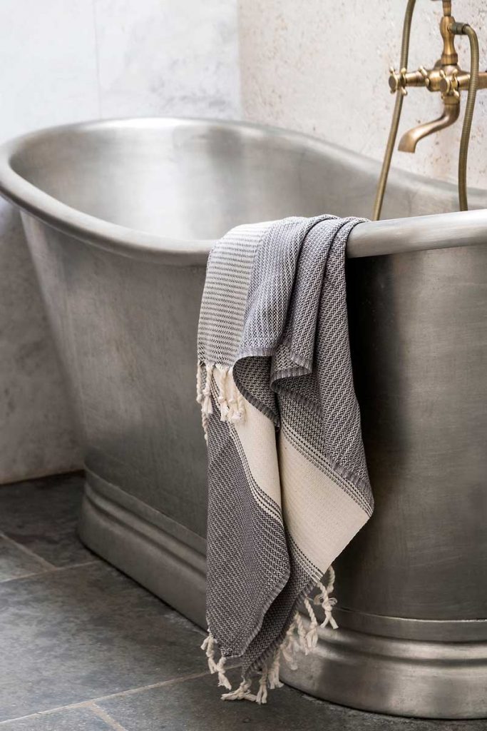 a silver freestanding bath