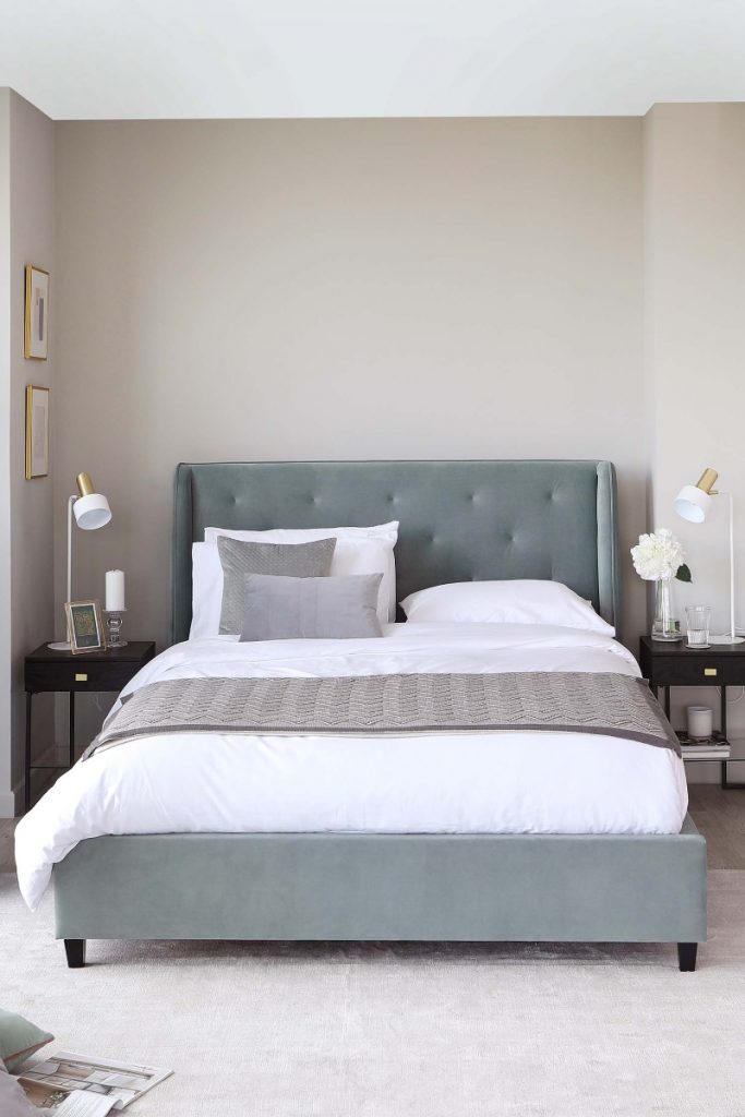 muted bed with curved headboard