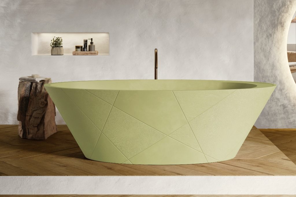 pale pastel green bath with brass tap